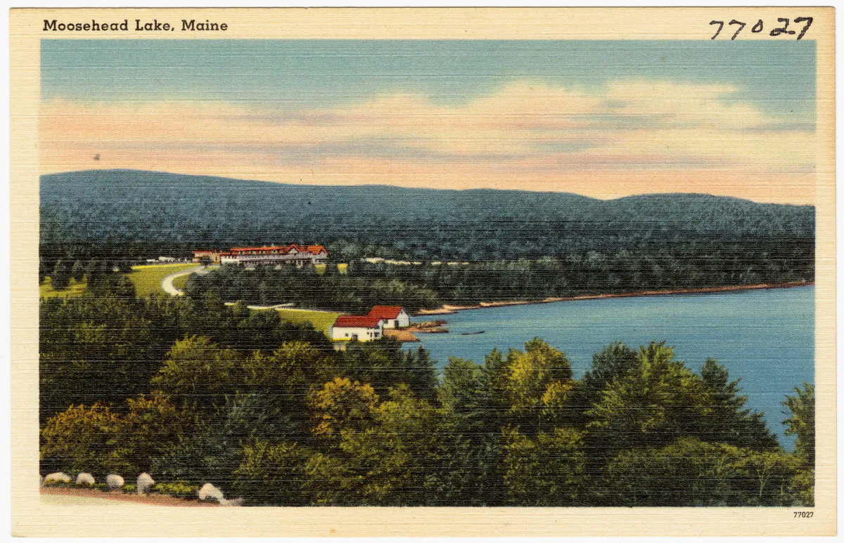 Vintage view of Moosehead Lake in Maine, with forested mountains and Mount Kineo rising from the lake surface